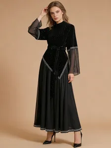 Elegant long sleeve black maxi dress with velvet and mesh patchwork and waist tie
