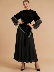 Elegant black velvet and mesh patchwork pleated long dress with belted waist