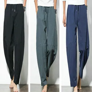 Collection of men's loose-fit harem pants available in black, teal, and navy blue colors