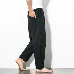 Side view of men's loose black harem pants featuring a comfortable Chinese style fit