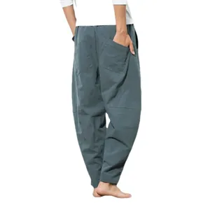 Men's Chinese style baggy harem pants in charcoal gray with large functional pockets