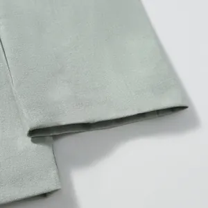 High-quality cotton linen fabric detail showing texture on men's jacket sleeve cuff