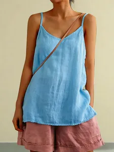 Close-up of lightweight blue linen camisole showing breathable fabric texture