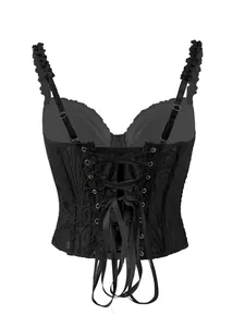Dettaglio posteriore di un corsetto vintage in pizzo nero con allacciatura a nastro.