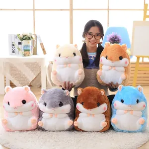 Collection of colorful hamster plush pillows shown in a cozy home setting