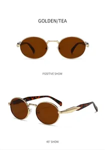 Vista detallada de gafas de sol ovaladas de metal dorado vintage con lentes de té