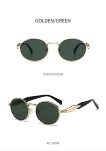 Primer plano de gafas de sol ovaladas vintage de metal dorado y cristales verdes