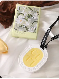 Detailed view of scented wax sachet with lily-patterned gift box