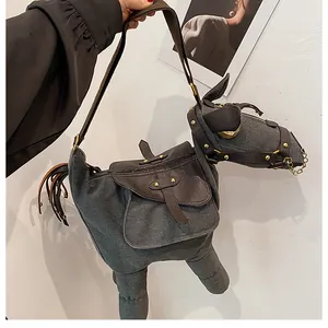 Unique donkey-shaped canvas crossbody bag with brown leather accents and gold hardware.