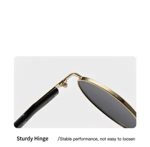 Detailed macro shot of a sturdy metal hinge on luxury oval sunglasses for women