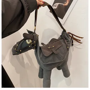 Close-up of a quirky donkey-shaped grey canvas shoulder bag with brown accents.