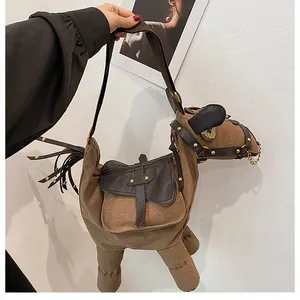 Quirky donkey shaped brown canvas shoulder bag with a unique leather saddle flap detail.
