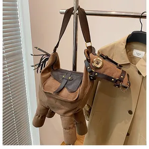 Unique quirky brown donkey-shaped canvas crossbody bag with detailed faux leather saddle
