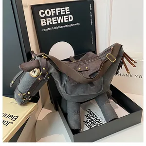 Close-up detail of unique donkey-shaped canvas crossbody bag featuring quirky design