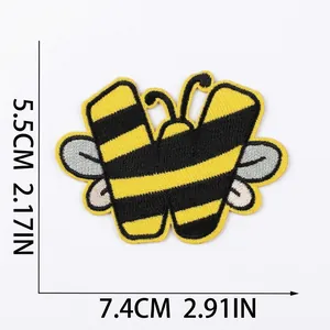 Macro view of a cartoon bee-styled embroidered letter W patch showing detailed dimensions