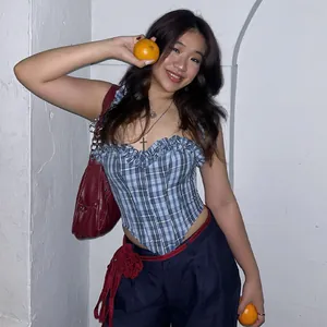 Stylish blue plaid corset top and dark blue trousers set with red flower belt detail