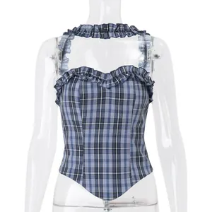 Detail of blue plaid camisole top with ruffled straps on a transparent mannequin torso