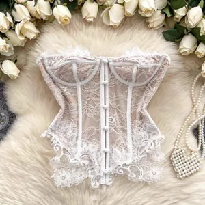 Detail of white floral lace corset top with elegant button front and eyelash trim