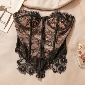 Detailed view of a vintage-style black lace corset top with front button closure