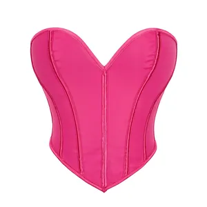 Vista dettagliata del corsetto rosa a forma di cuore con pannelli in rete e stecche