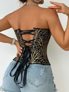 Elegante top a corsetto di paillettes nero e oro con lacci regolabili sulla schiena.