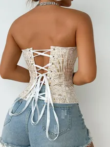 Primo piano del corsetto vintage con paillettes e dettaglio stringato bianco sul retro