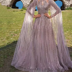 Elegant lavender sequin evening gown featuring mesh overlay and dramatic cape sleeves detail