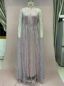 Elegant pink mesh evening gown with silver sequin fringe details shown on mannequin