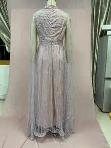 Back view of pink mesh evening gown with silver sequin fringes and cape sleeves