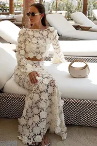 Full view of French lace two-piece set with 3D floral appliqués in resort setting