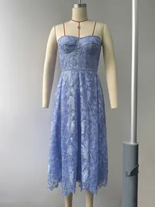Detailed view of light blue floral lace dress with spaghetti straps on mannequin