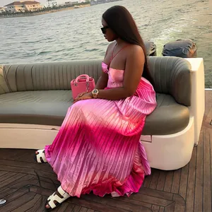 Elegant gradient pink pleated maxi dress with halter neckline for summer vacation look