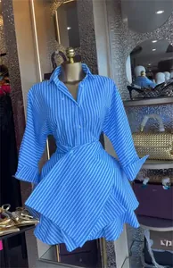 Detail view of blue and white striped shirt dress with a stylish wrap high waist
