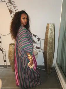 African-style striped loose kaftan maxi dress with elegant tassel details