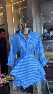 Blue and white striped shirt dress with a lapel collar and an asymmetrical wrap skirt design.