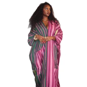 Plus size African style striped kaftan maxi dress with vibrant purple and green patterns