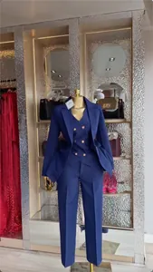 Professional navy blue three-piece suit set with blazer vest and trousers on display