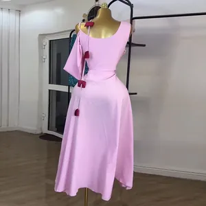 Elegant pink one-shoulder midi dress with high waist and stylish wine red bow accents