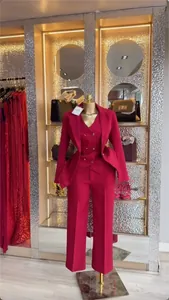 Elegant magenta 3-piece women's office suit with blazer, vest, and trousers on display.