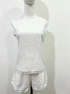 Detail view of the white eyelet embroidery sleeveless top and shorts two-piece set