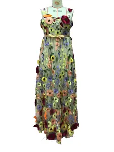 Close-up of vibrant 3D floral embroidery and bow waist on elegant mesh maxi dress