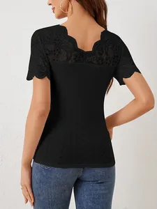 Elegant back view of black slim-fit T-shirt with lace patchwork and scalloped V-neck