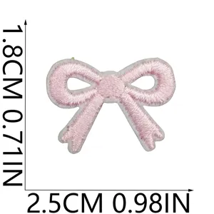 Detailed close-up of pink embroidered bow patch with 1.8cm x 2.5cm size measurement markings