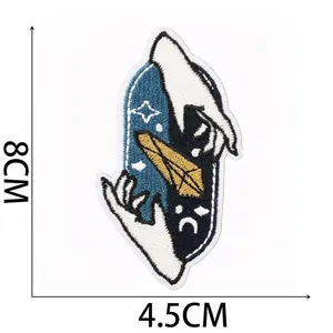 Detailed macro view showing the embroidery texture of a mystical witch crystal patch