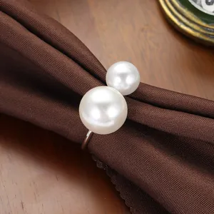 Elegant silver napkin ring featuring double white pearls for luxury table setting decoration