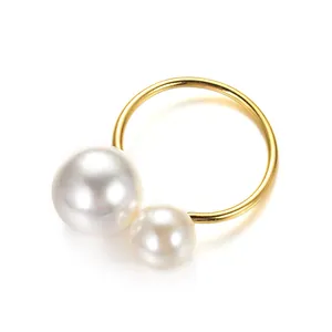 Elegant gold finish napkin ring featuring double pearl accents for stylish table decor
