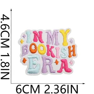 Detail view of 'IN MY BOOKISH ERA' colorful embroidered patch with size markers