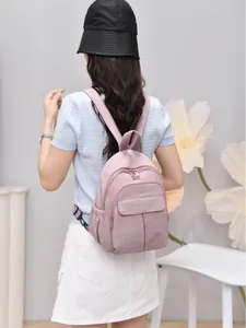 Mini pink waterproof nylon backpack for women with multiple pockets for daily travel