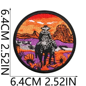 Detailed view of circular Western Cowboy embroidered patch with sunset theme, 6.4cm size