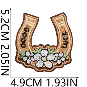 Detailed view of 5.2x4.9cm cowboy horseshoe embroidered patch with Good Luck text